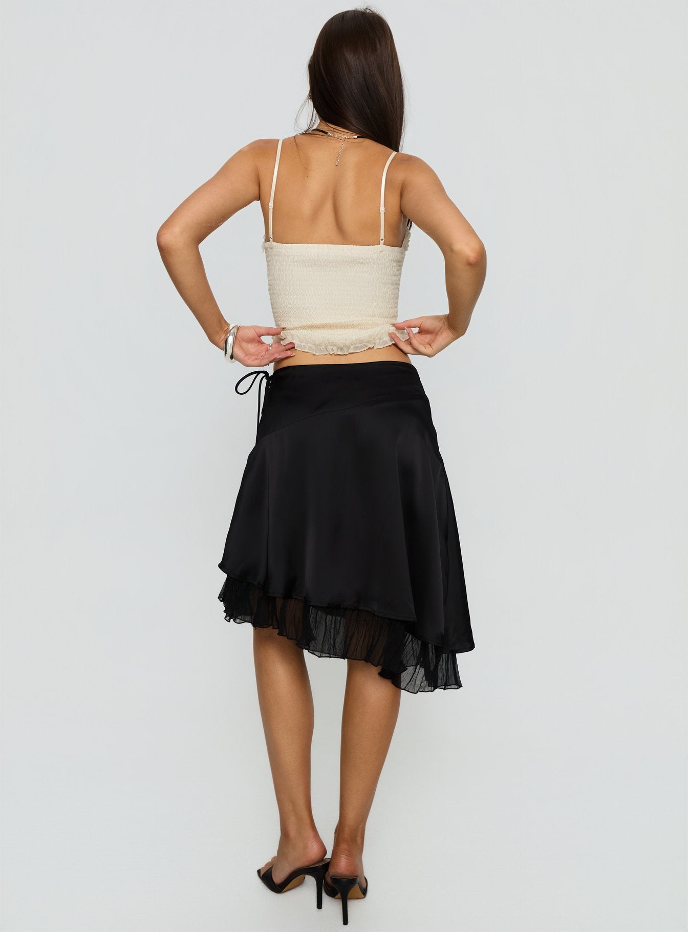 back view of model wearing Princess Polly Rosemead Satin Midi Skirt Black Midi Skirts 
