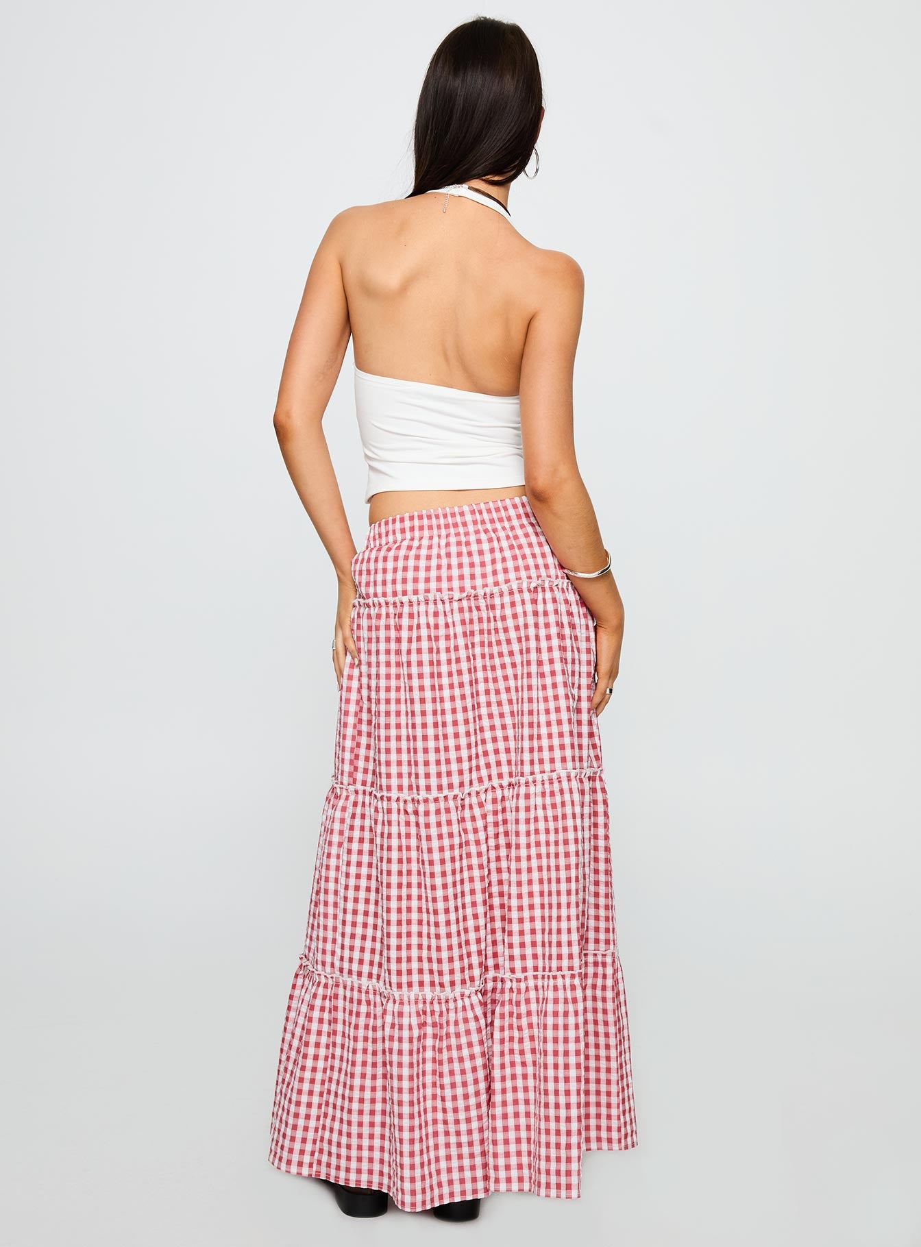 back view of model wearing Princess Polly Ilaina Tiered Maxi Skirt Red Check Maxi 