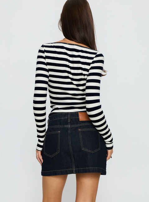 back view of model wearing Princess Polly Nickei Denim Mini Skirt Raw Dark Wash Mini Skirts 