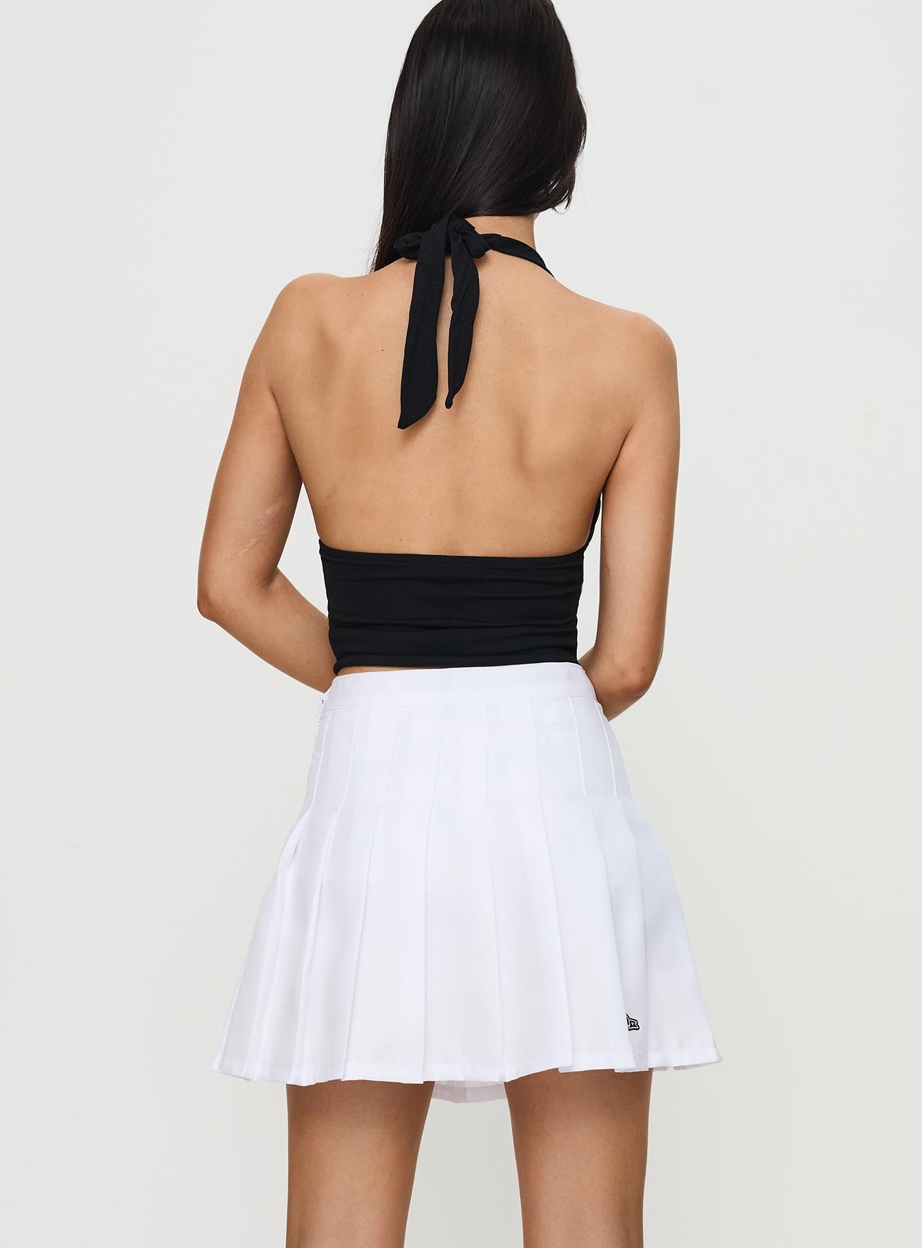 back view of model wearing Princess Polly USC Tennis Skort White 