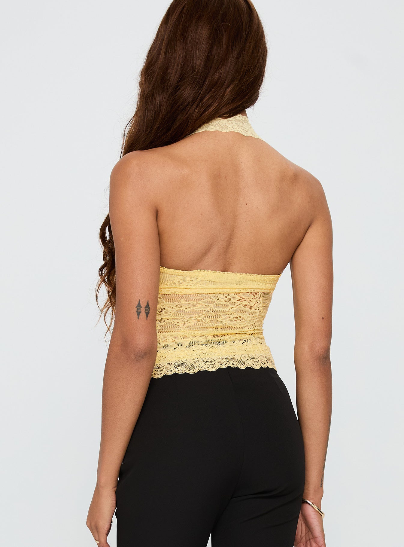 back view of model wearing Princess Polly Fantasize Lace Halter Top Yellow Sleeveless Sweetheart 
