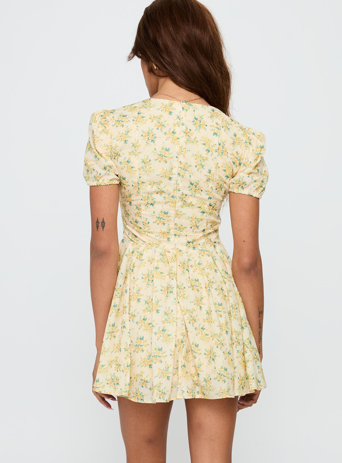 back view of model wearing Princess Polly Ethelyn Mini Dress Yellow Floral V-Neck 