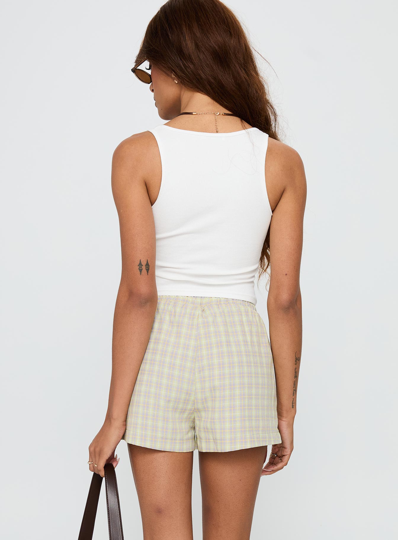 back view of model wearing Princess Polly Star Blaze Shorts Green Check High Waisted Shorts 