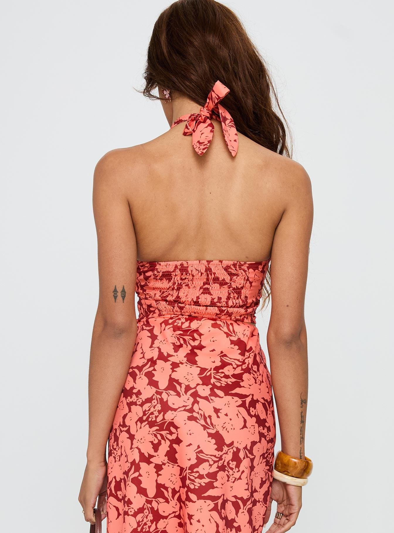 back view of model wearing Princess Polly Casablanca Halter Top Red Floral Sleeveless Plunger 