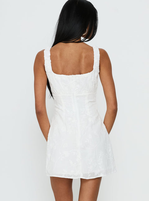 in the meadow white embroidered backless mini dress Meadow Dreams Mini Dress