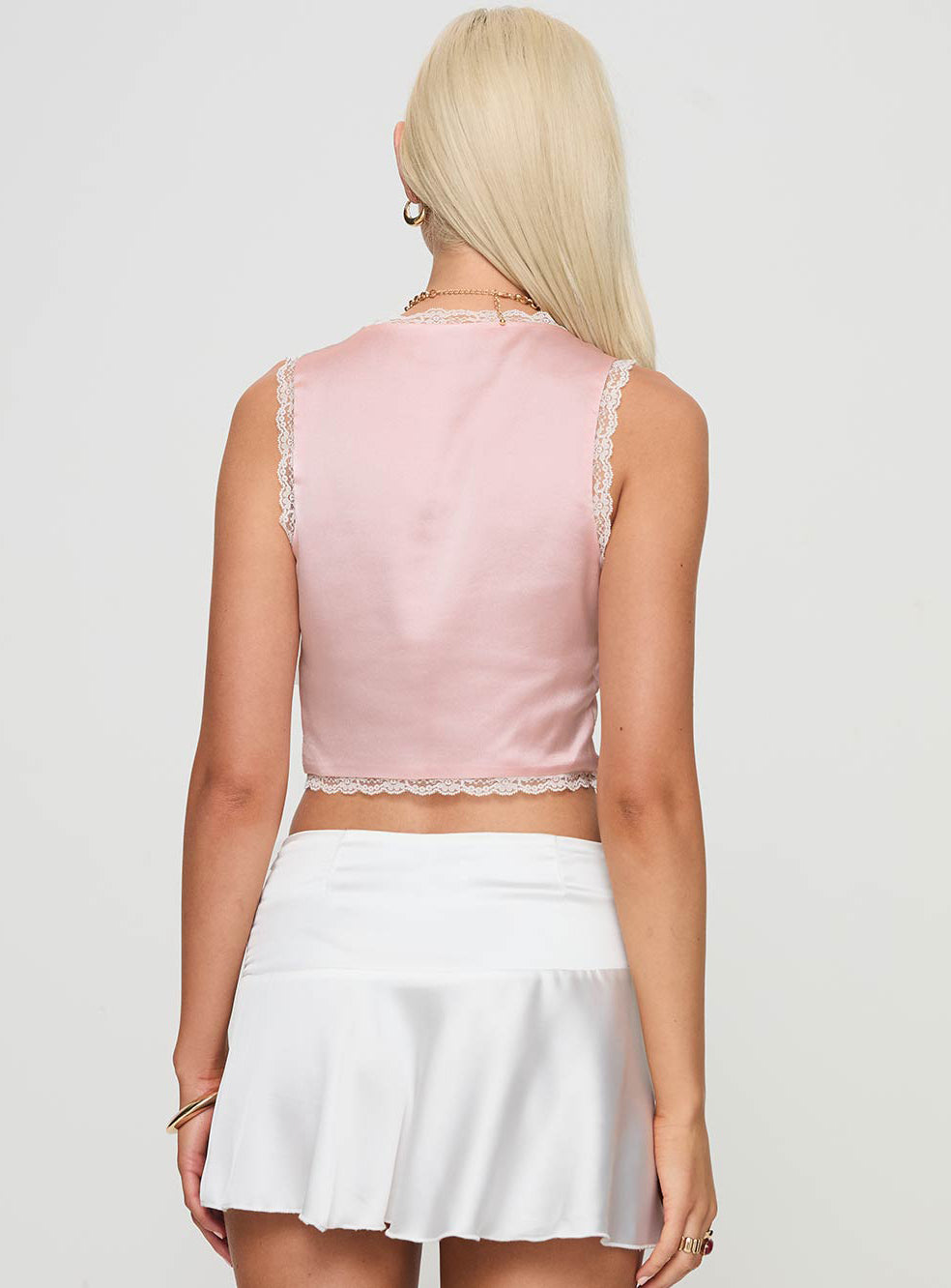 back view of model wearing Princess Polly Dominick Top Pink Sleeveless Plunger 