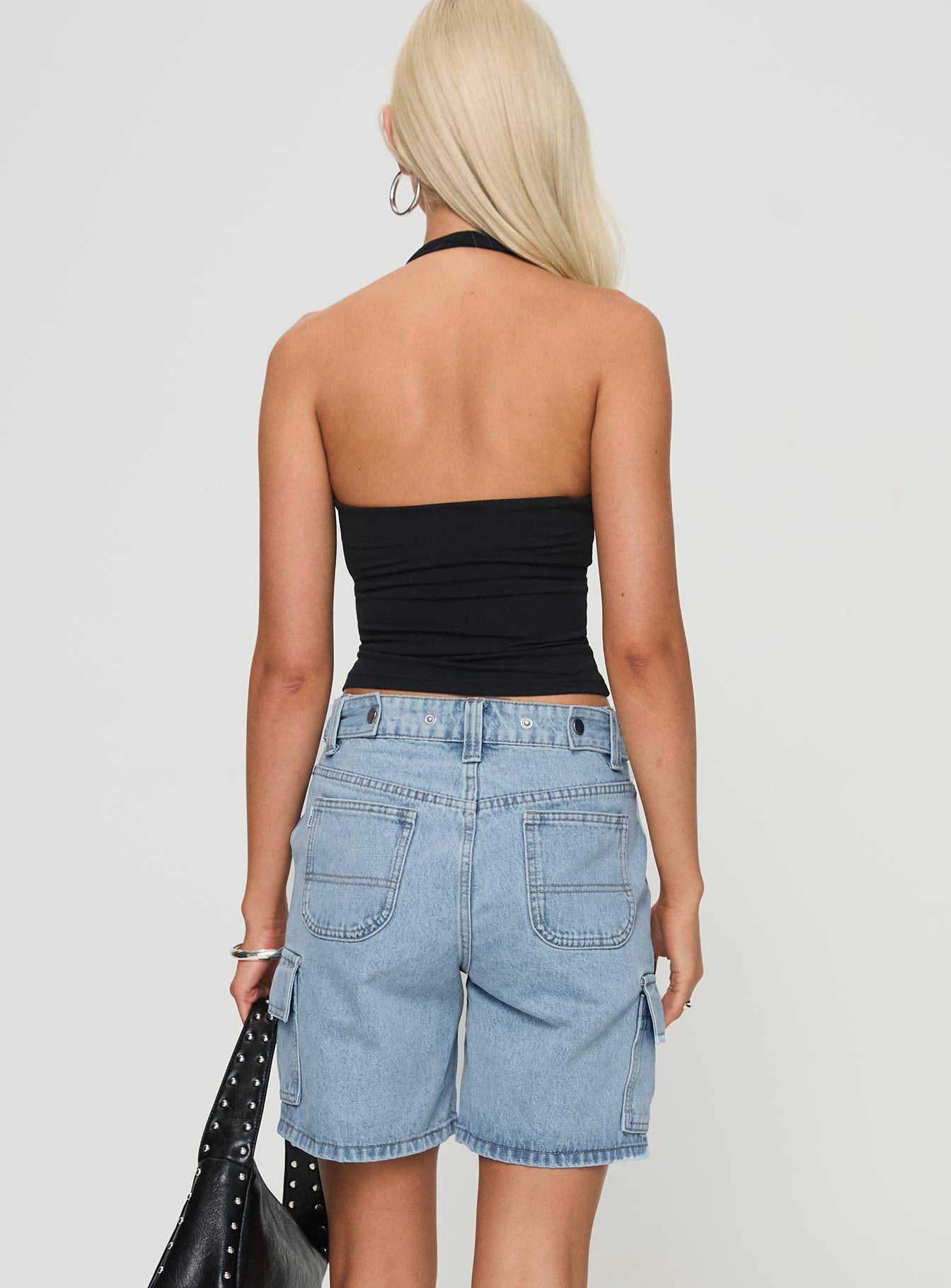 back view of model wearing Princess Polly Mika Carpenter Denim Shorts Light Wash High Waisted Shorts 