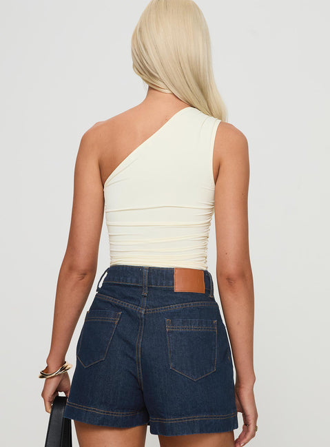 back view of model wearing Princess Polly Annem One Shoulder Top Cream Sleeveless Asymmetric Neckline 