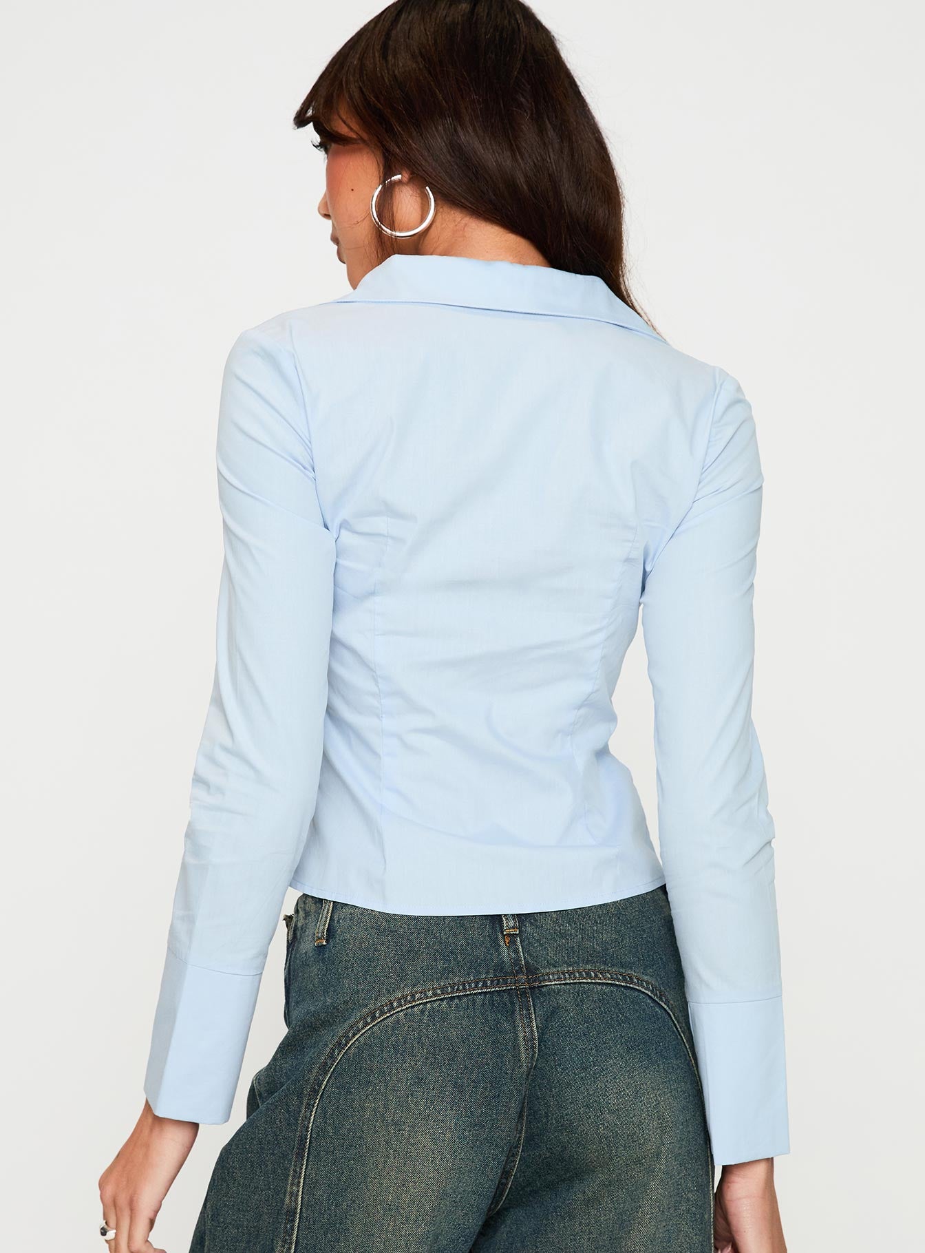 back view of model wearing Princess Polly Zifa Shirt Blue Full Sleeves V-Neck 