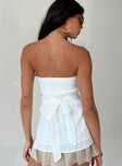 Strapless top Inner silicone strip at bust Shirred band at back  Waist tie fastening at back Split hem