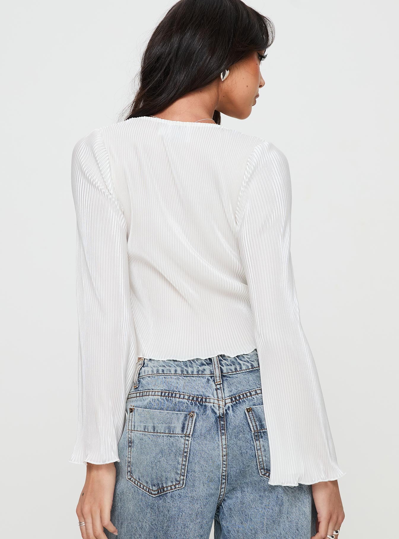 back view of model wearing Princess Polly Collis Long Sleeve Top Cream Full Sleeves V-Neck 