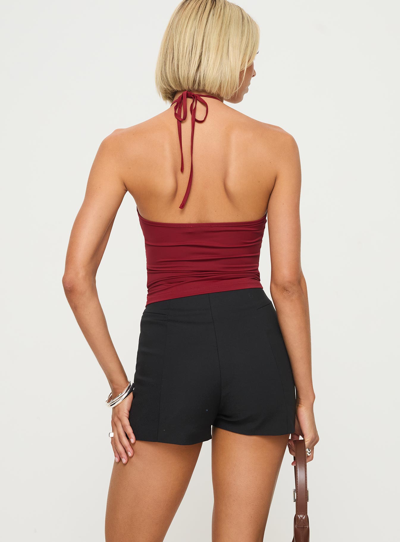 back view of model wearing Princess Polly Vickie Halter Top Red Sleeveless Crew Neck 