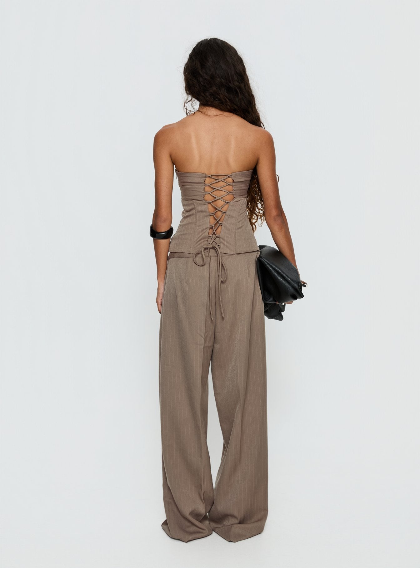 back view of model wearing Princess Polly Madelle Mid Rise Straight Leg Pants Brown Pinstripe Mid Rise Pants 