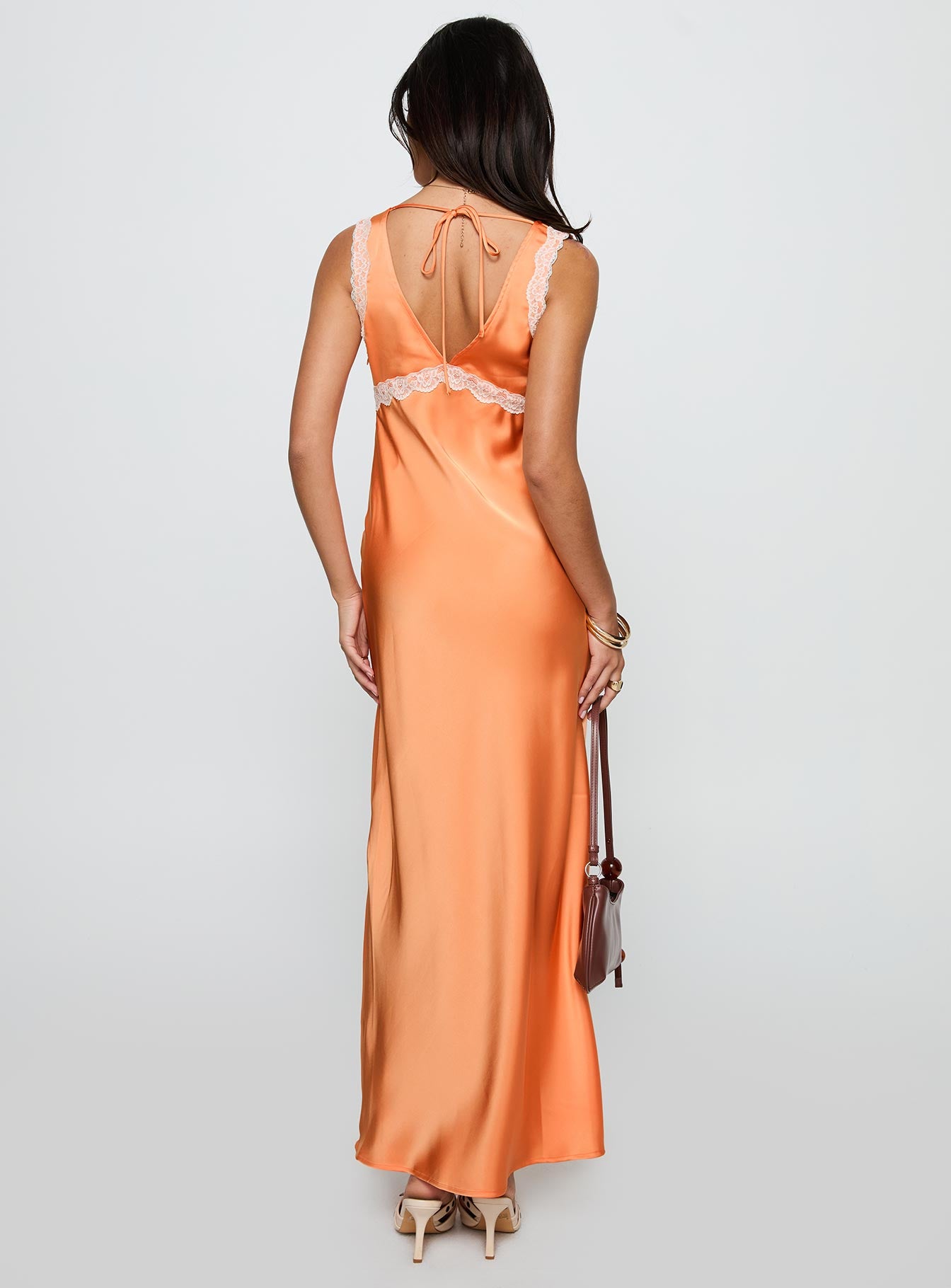 back view of model wearing Princess Polly Natassja Maxi Dress Orange V-Neck 