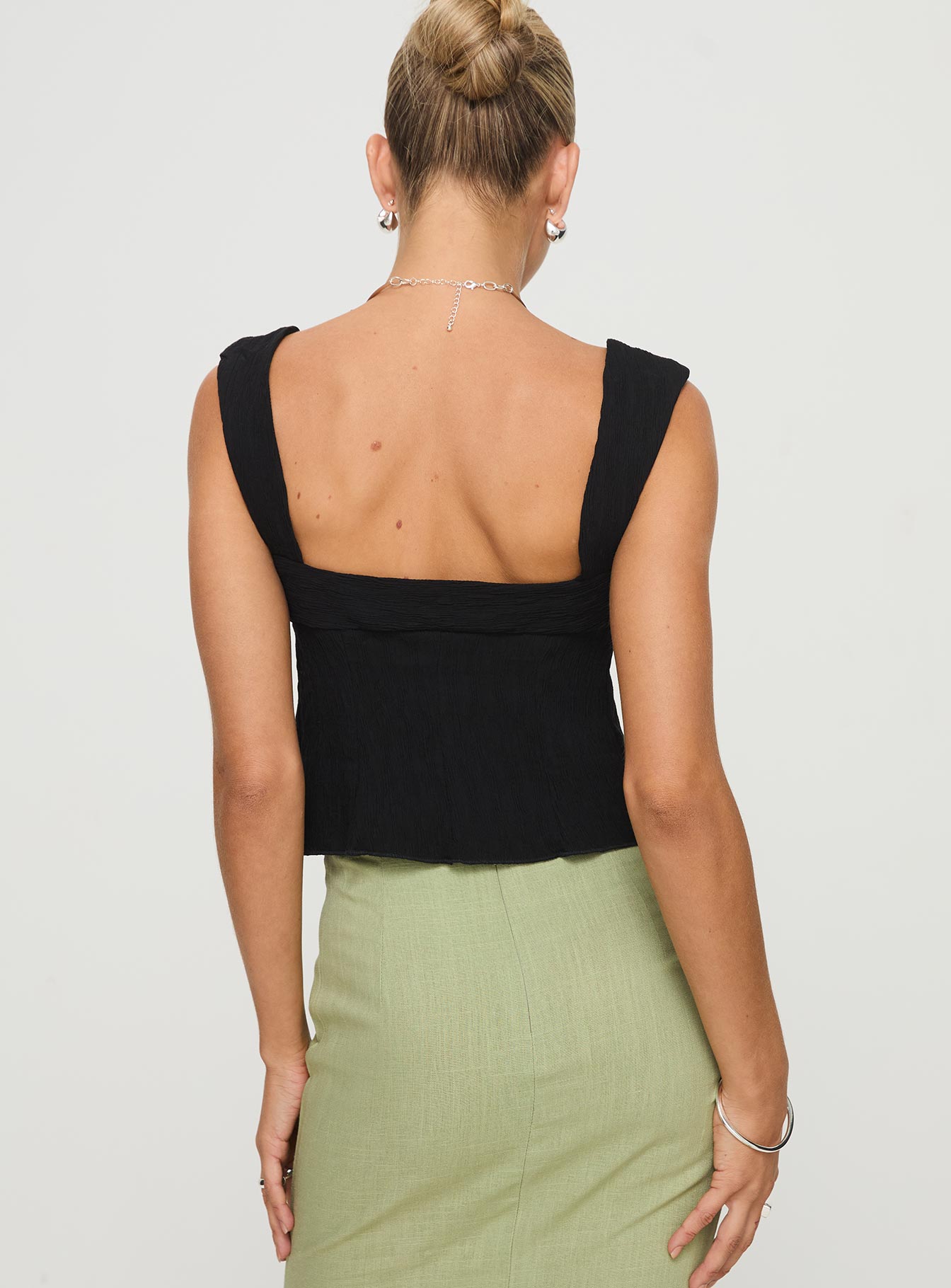 back view of model wearing Princess Polly Moshe Top Black Sleeveless Sweetheart 