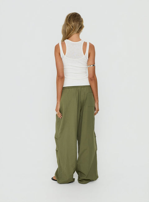Style the Mankind Baggy Cargo Pants Olive in womens-regular-pants featuring mid-rise waist back view of model wearing Princess Polly