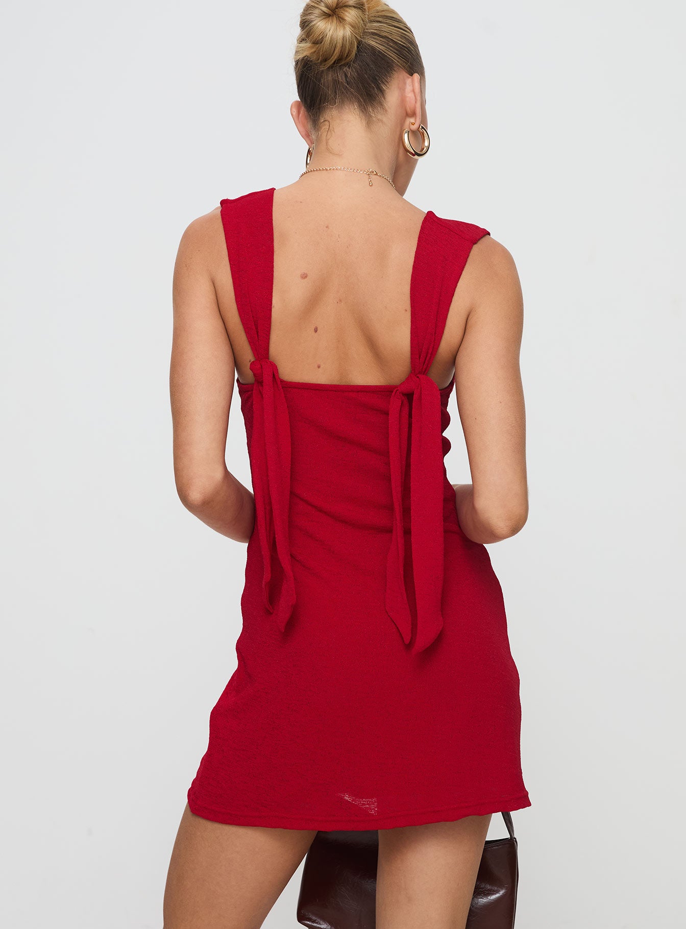 back view of model wearing Princess Polly Steward Mini Dress Red Petite Plunger 