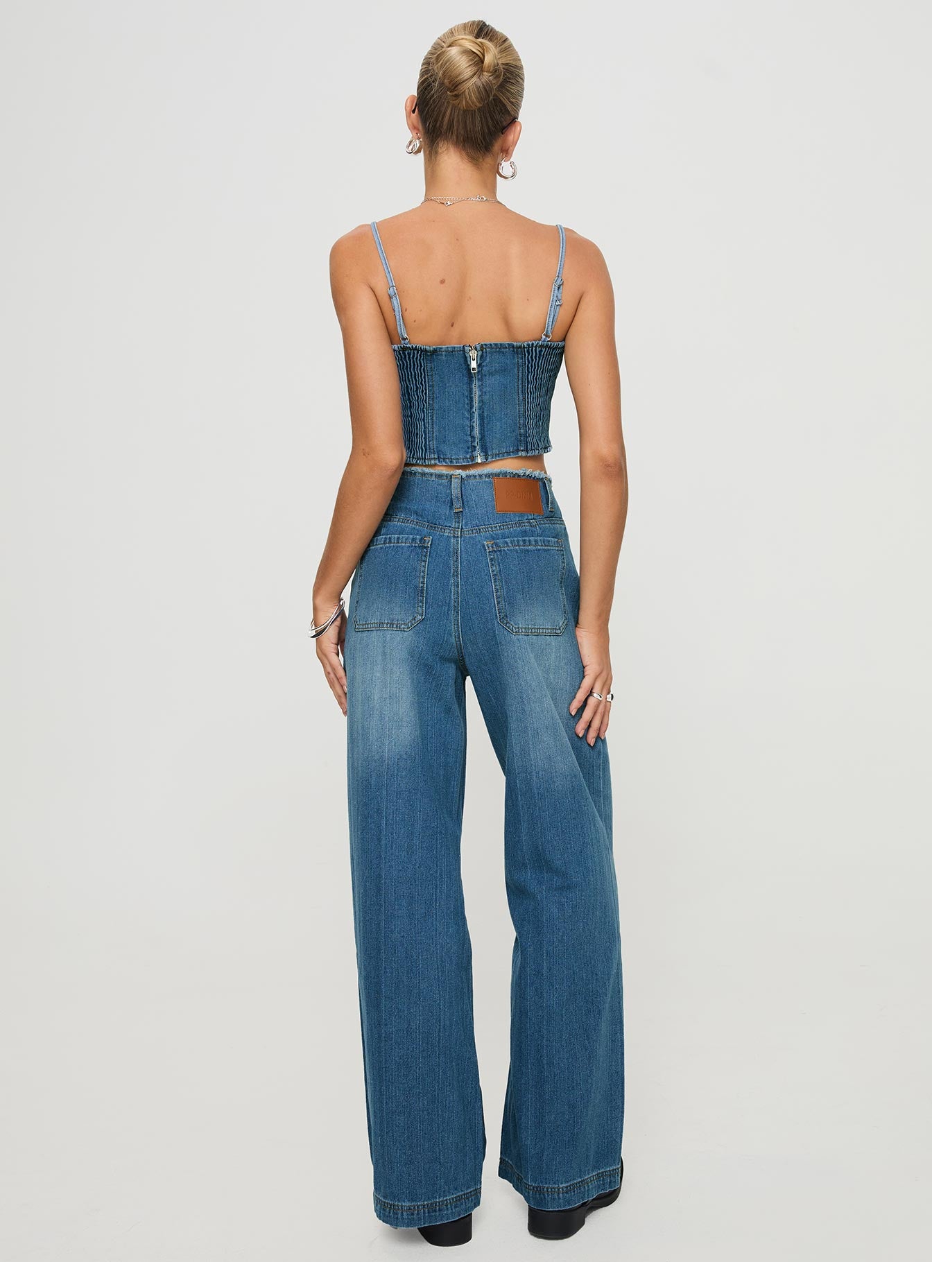 back view of model wearing Princess Polly Vihaan Wide Leg Pants Blue Wash High Waisted Pants 