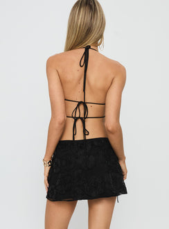 back view of model wearing Princess Polly Wild Card Beaded Tie Mini Skirt Black Mini Skirts 