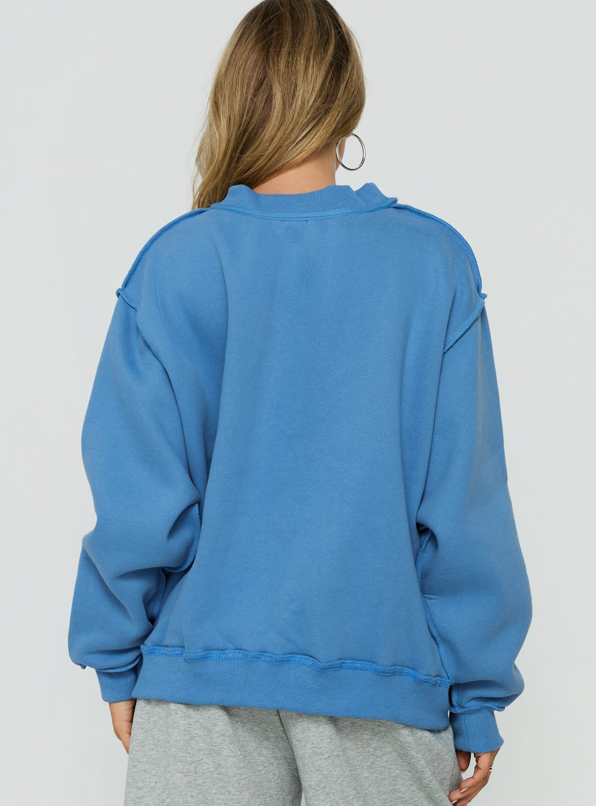 Styled in the When In New York City Oversized Jumper Blue womens jumper with long fit back view of model wearing Princess Polly
