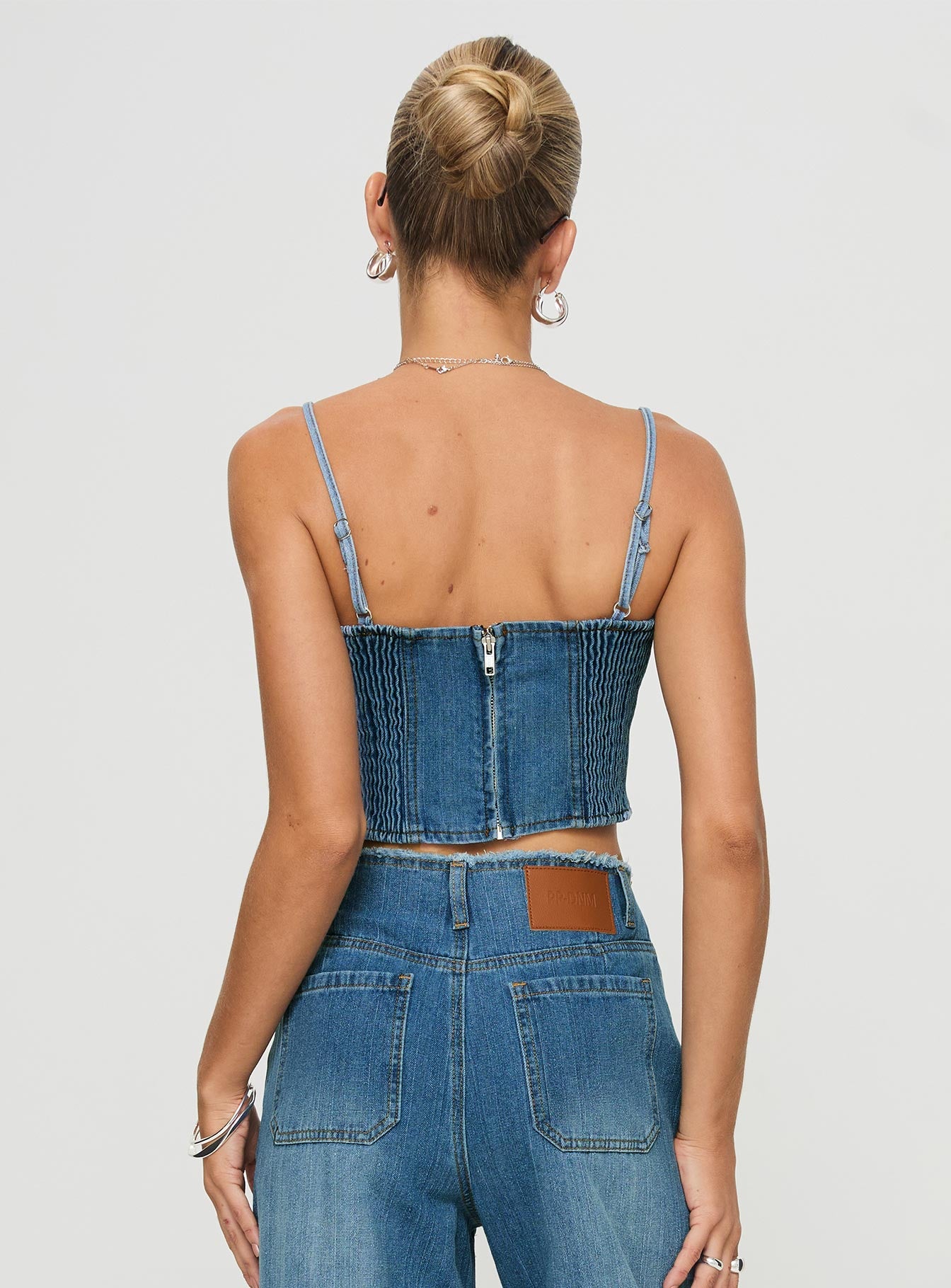 back view of model wearing Princess Polly Vihaan Top Blue Wash Sleeveless Square Neck 
