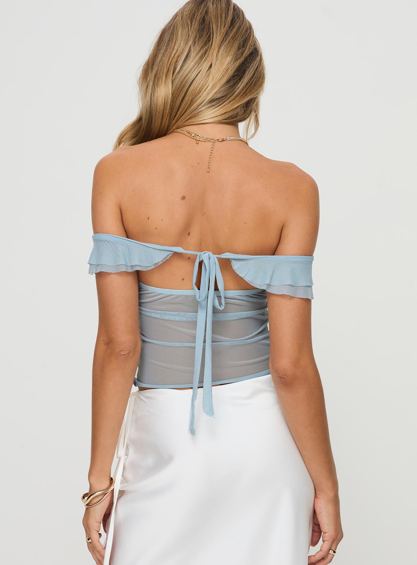 back view of model wearing Princess Polly Loire Off Shoulder Top Blue Short Sleeves Sweetheart 