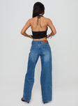 back view of model wearing Princess Polly Serenitia Mid Rise Relaxed Jeans Mid Blue Wash Mid Rise 