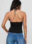 back view of model wearing Princess Polly Averee Halter Top Black Sleeveless Plunger 