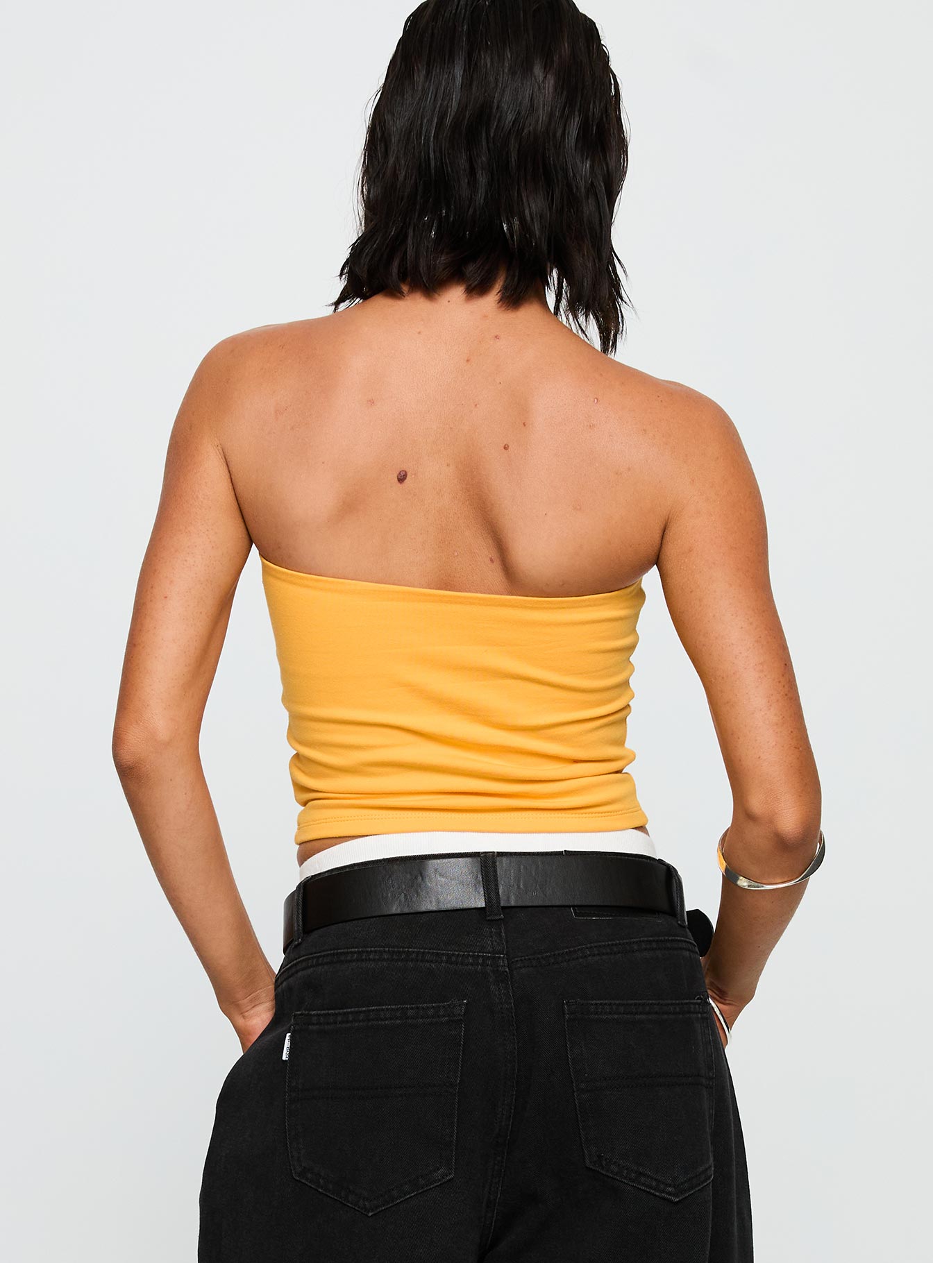 back view of model wearing Princess Polly USC Tube Top Gold Sleeveless straight 