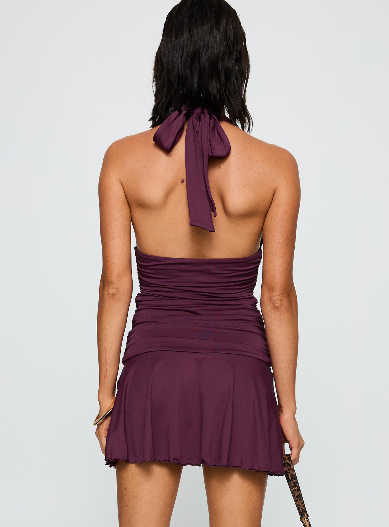 back view of model wearing Princess Polly Intrigue Halter Mini Dress Plum Plunger 