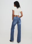 back view of model wearing Princess Polly Leslee Flare Jean Mid Wash Blue Mid Rise 