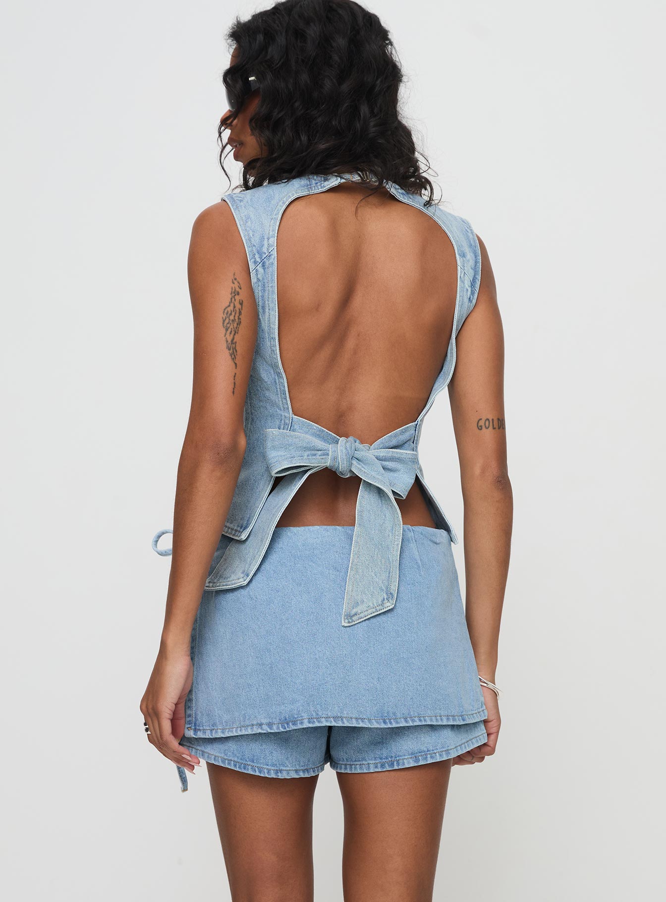 back view of model wearing Princess Polly Countryside Skort Classic Denim High Waisted Shorts 