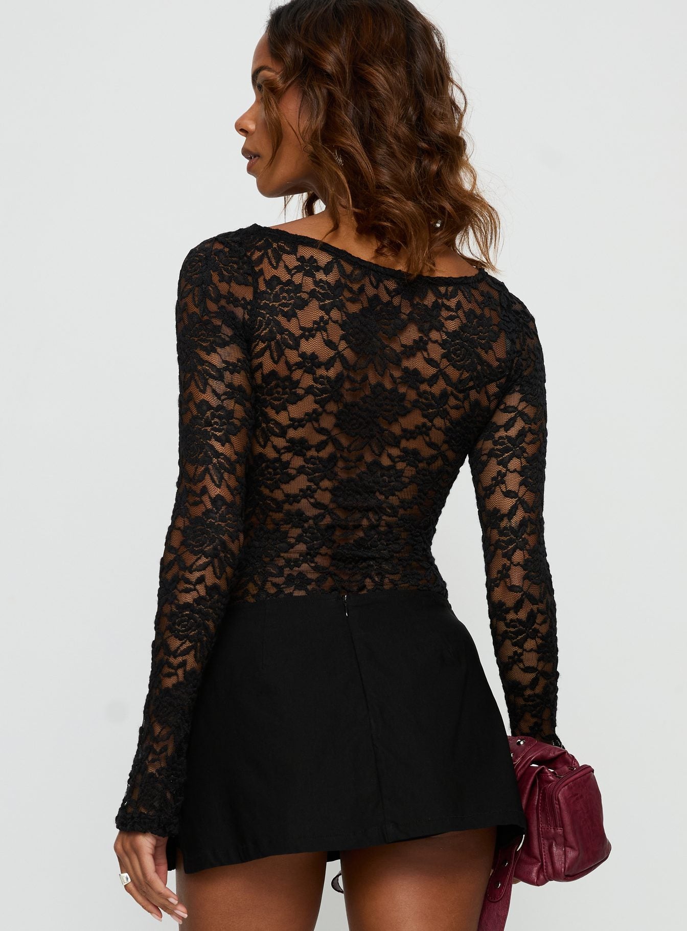 back view of model wearing Princess Polly Anjolene Lace Wrap Bust Bodysuit Black Long Sleeve Tops 