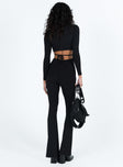 Long sleeve jumpsuit Ribbed material Square neckline Cut out at back with tie fastening Good stretch Partially lined