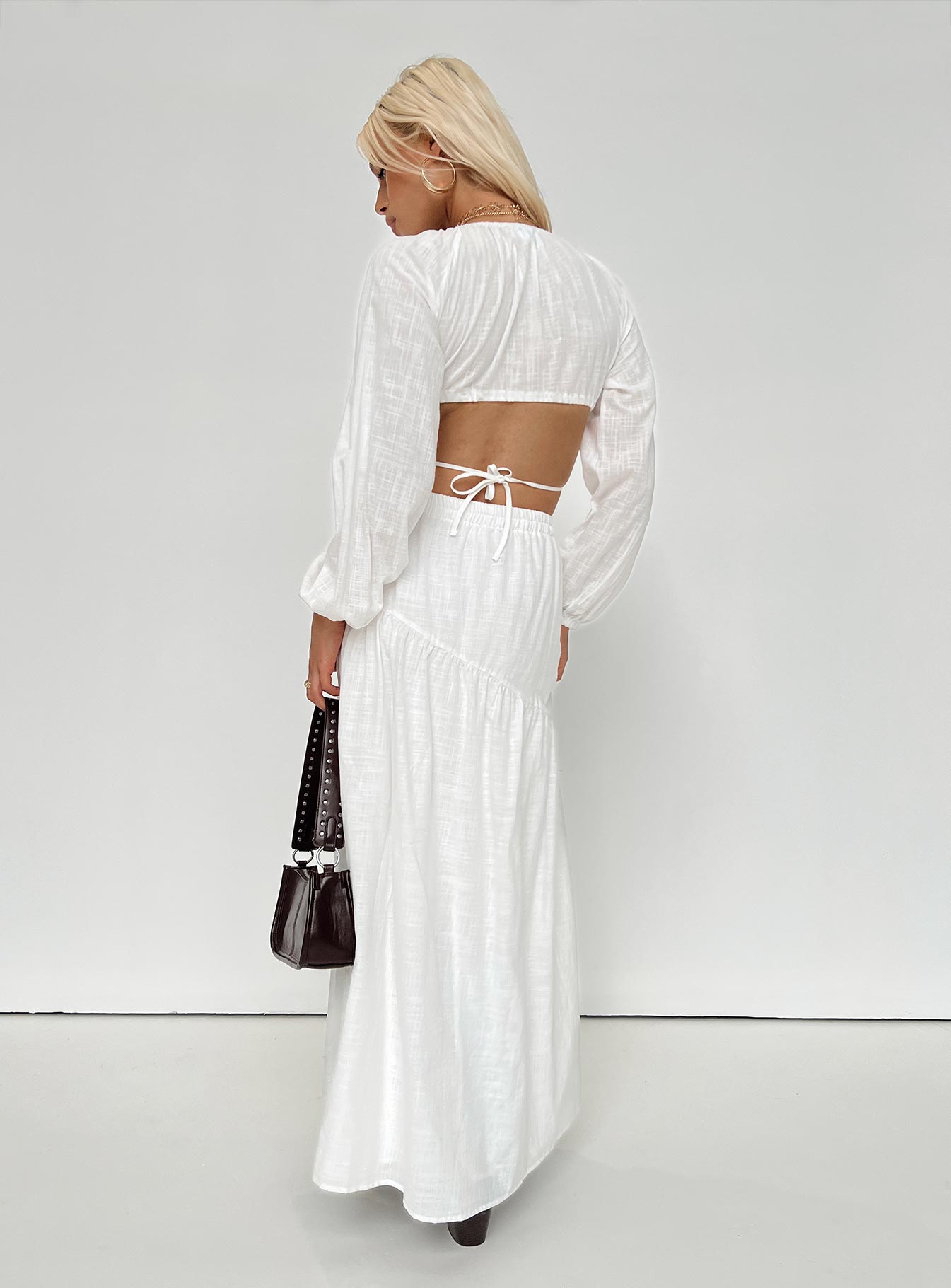 White matching set Long sleeve top Plunging neckline Adjustable coverage Tie fastening Maxi skirt Thick elasticated waistband Tiered skirt