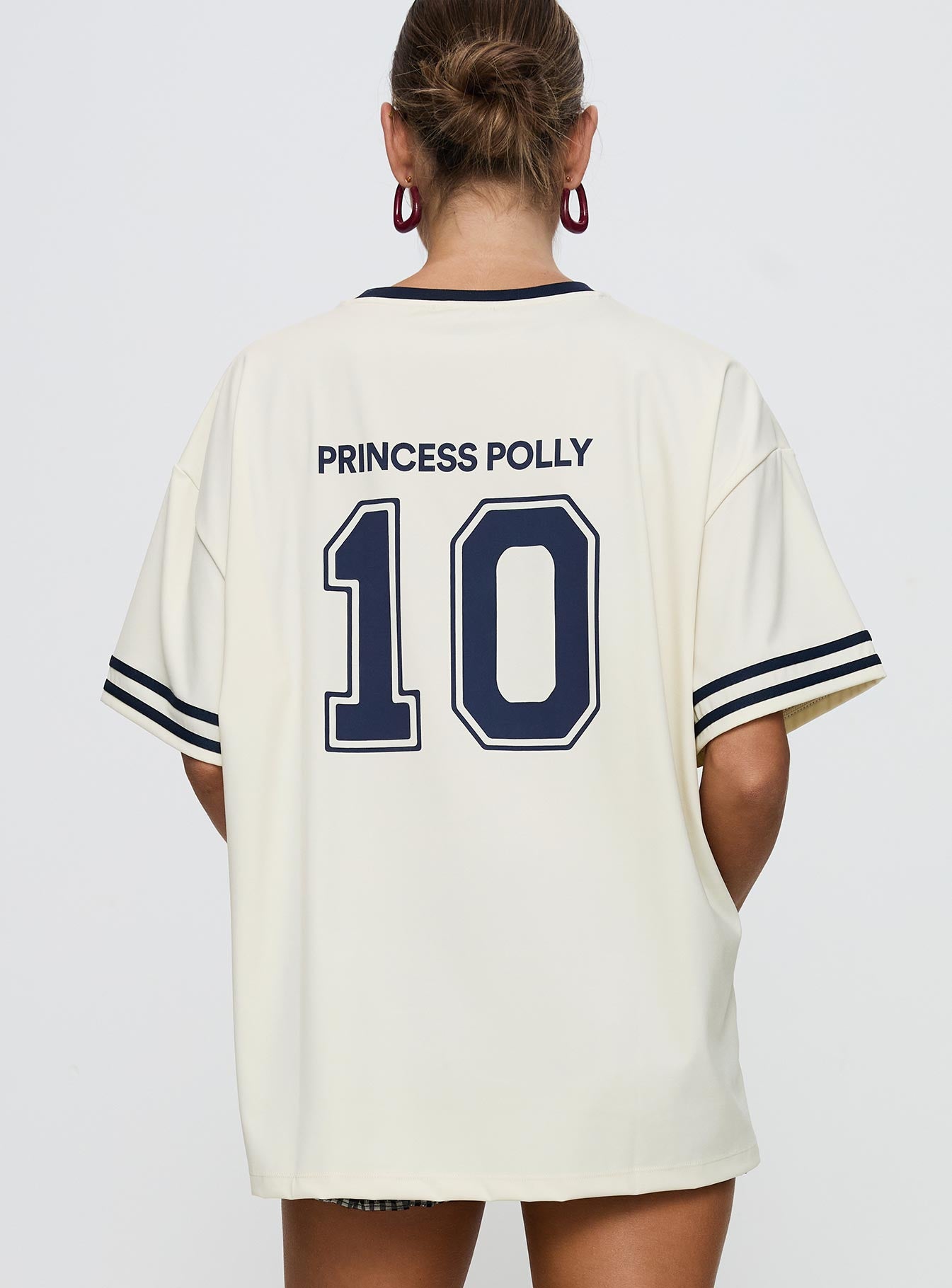 back view of model wearing Princess Polly Cornwall Football Jersey Cream Half Sleeves Crew Neck 