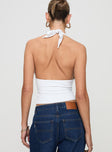 back view of model wearing Princess Polly Whimsy Halter Top White Sleeveless Plunger 