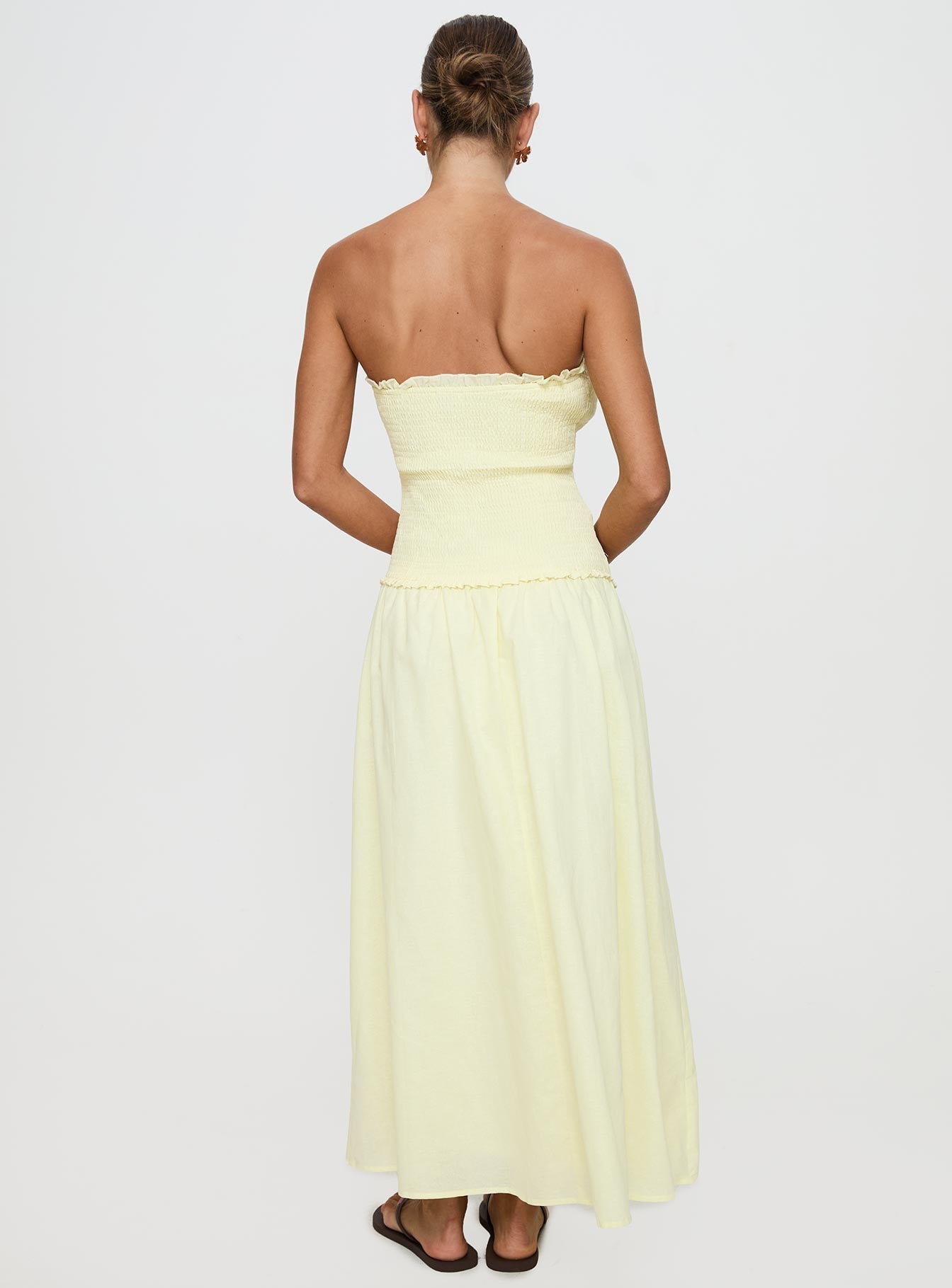 back view of model wearing Princess Polly Tinsie Strapless Maxi Dress Yellow Straight Neck 