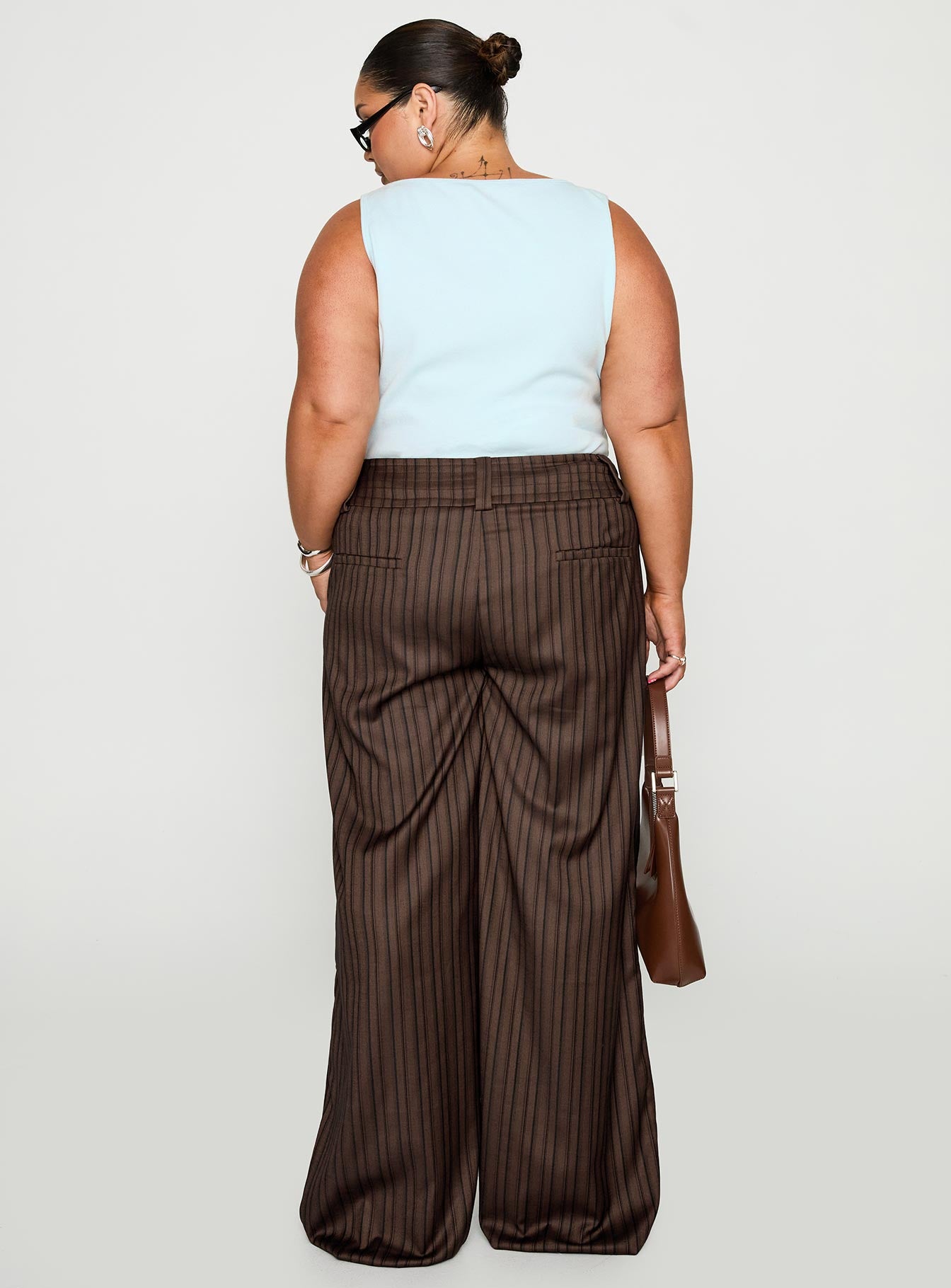 back view of model wearing Princess Polly Cedars Low Rise Pant Brown Stripe Curve Low Rise Pants 