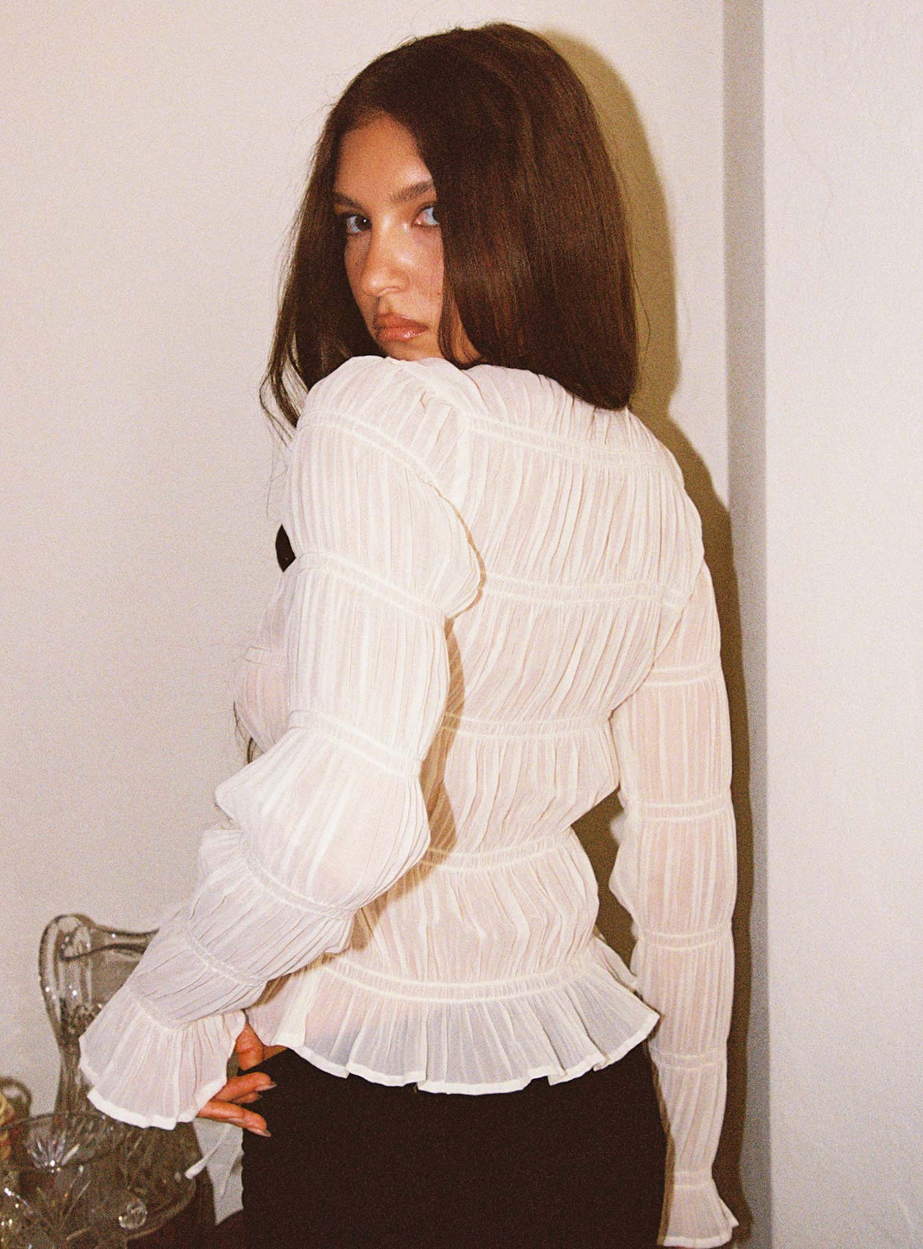 back view of model wearing Princess Polly Carnelian Frill Long Sleeve Top Cream Full Sleeves V-Neck 