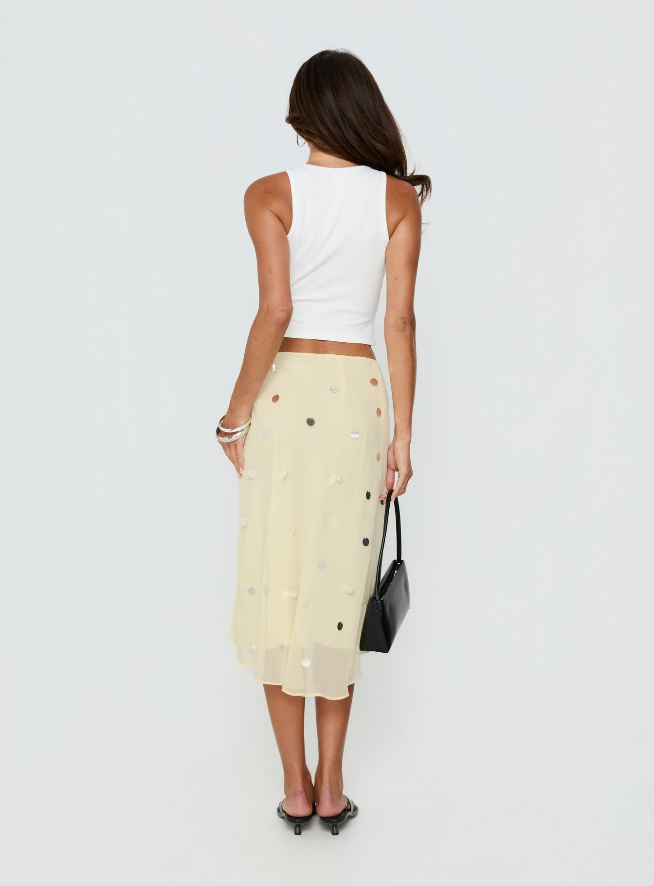 back view of model wearing Princess Polly Kessiah Sequin Midi Skirt Yellow Skirts 