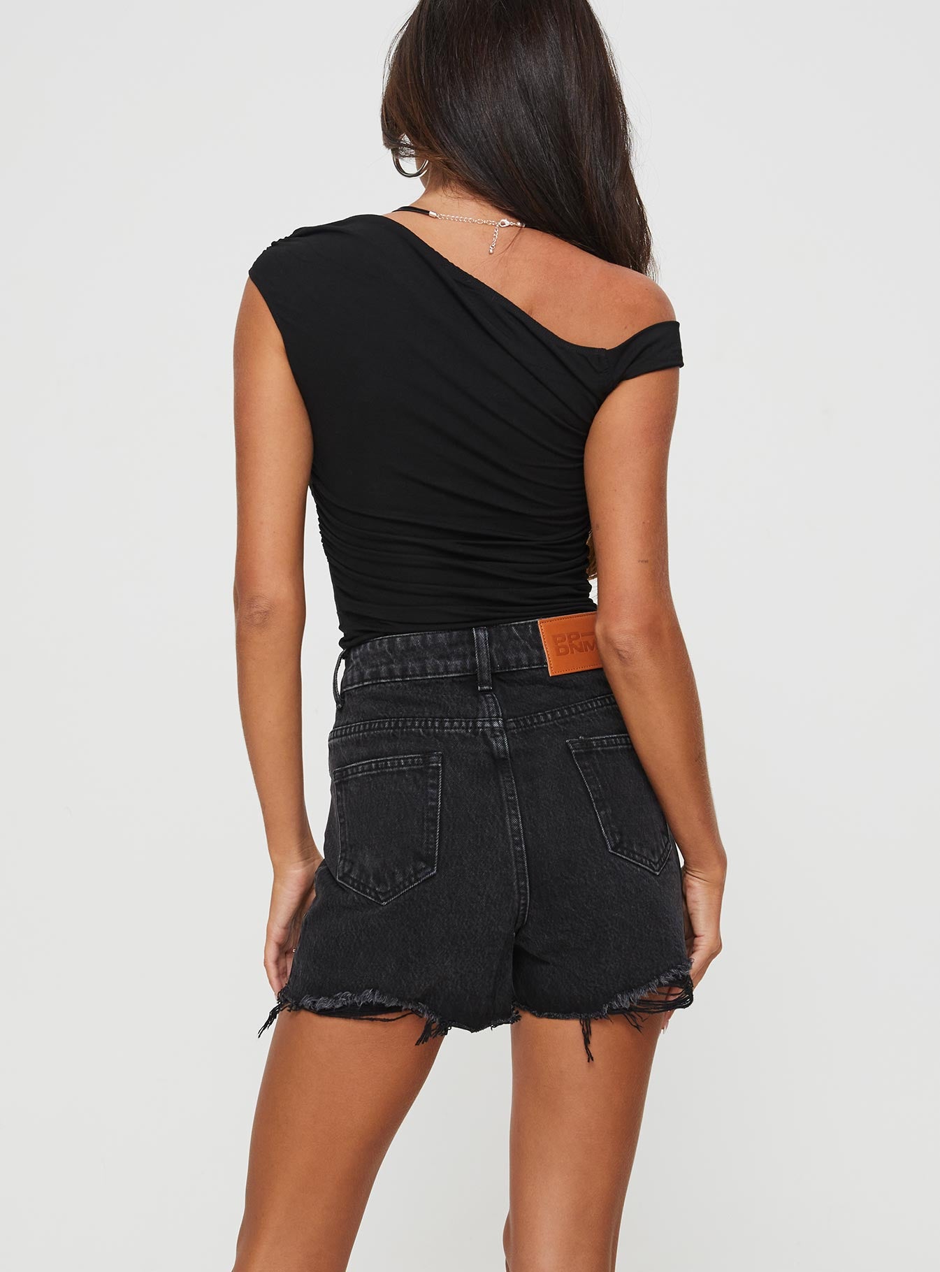 back view of model wearing Princess Polly Laurena Denim Shorts Washed Black High Waisted Shorts 