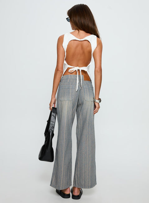 back view of model wearing Princess Polly Lifetimes Mid Rise Wide Leg Cargo Jeans Dark Blue Stripe Mid Rise Jeans 