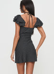 back view of model wearing Princess Polly Moretti Mini Dress Black Polka Dot Sweetheart Neckline 