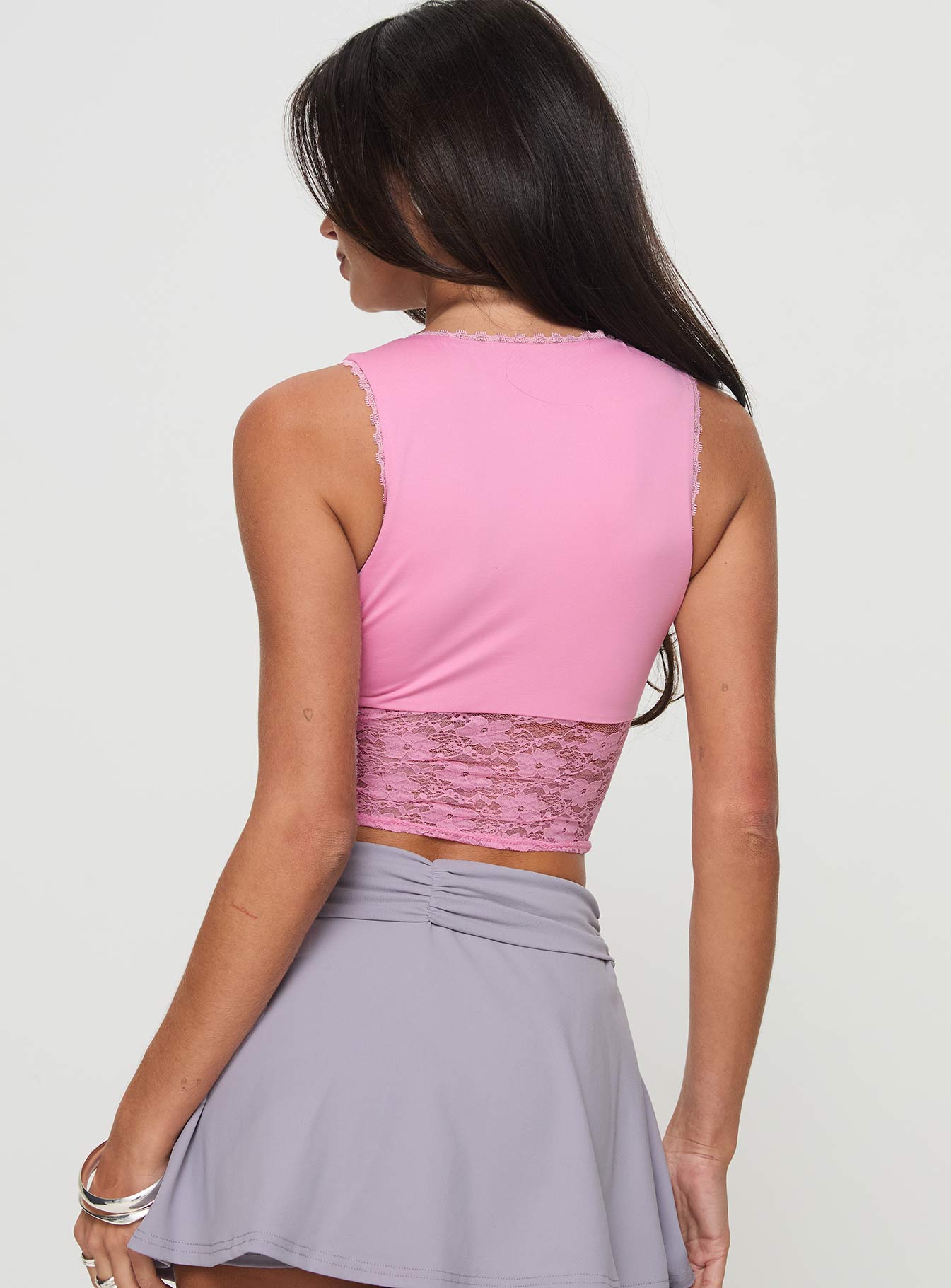 back view of model wearing Princess Polly Isolde Top Pink Sleeveless Plunger 
