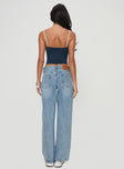 back view of model wearing Princess Polly Serenitia Mid Rise Relaxed Jeans Light Wash Tall Mid Rise 