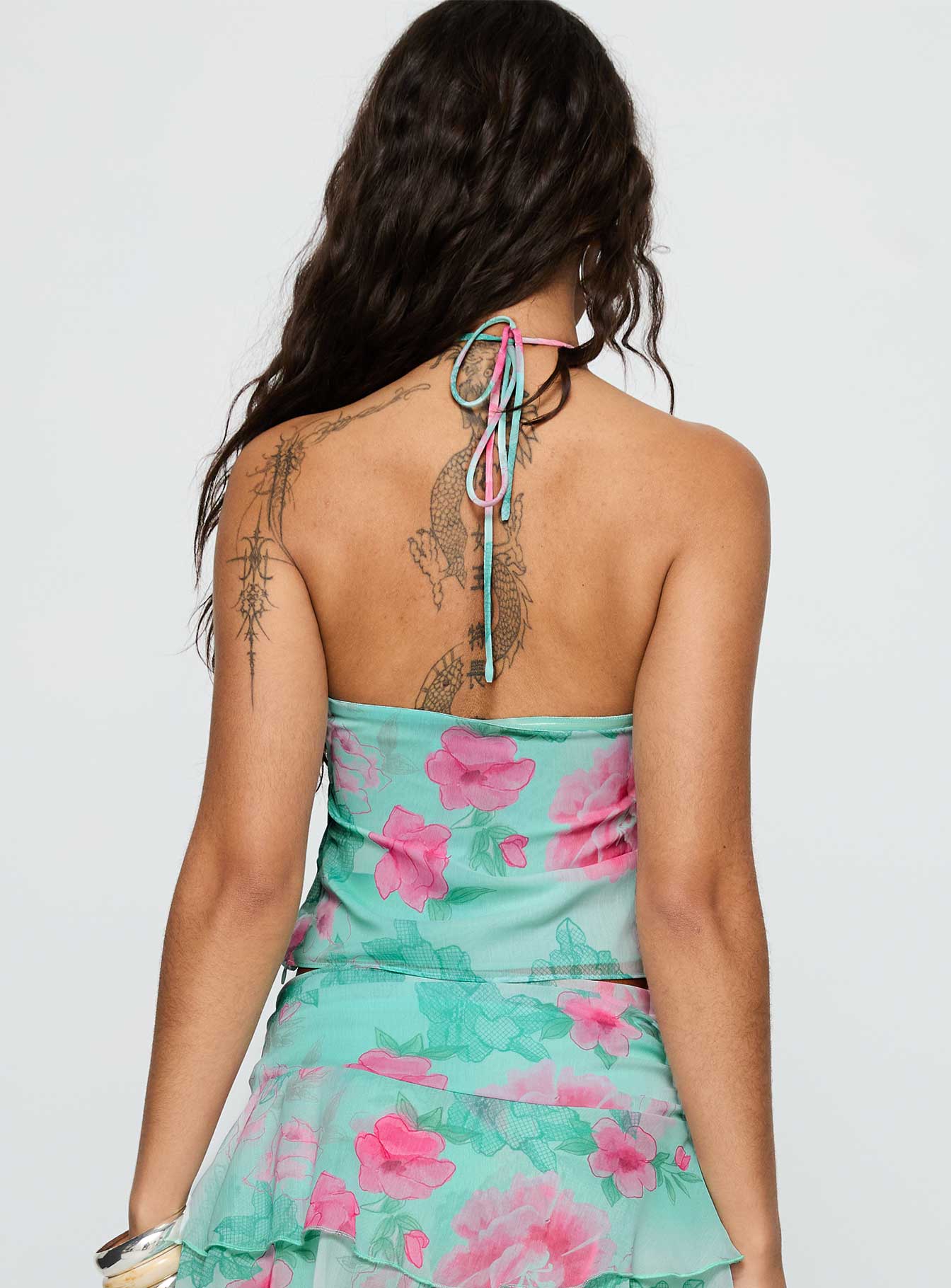 back view of model wearing Princess Polly Naturally Halter Ring Top Blue Multi Sleeveless Asymmetric Neckline 