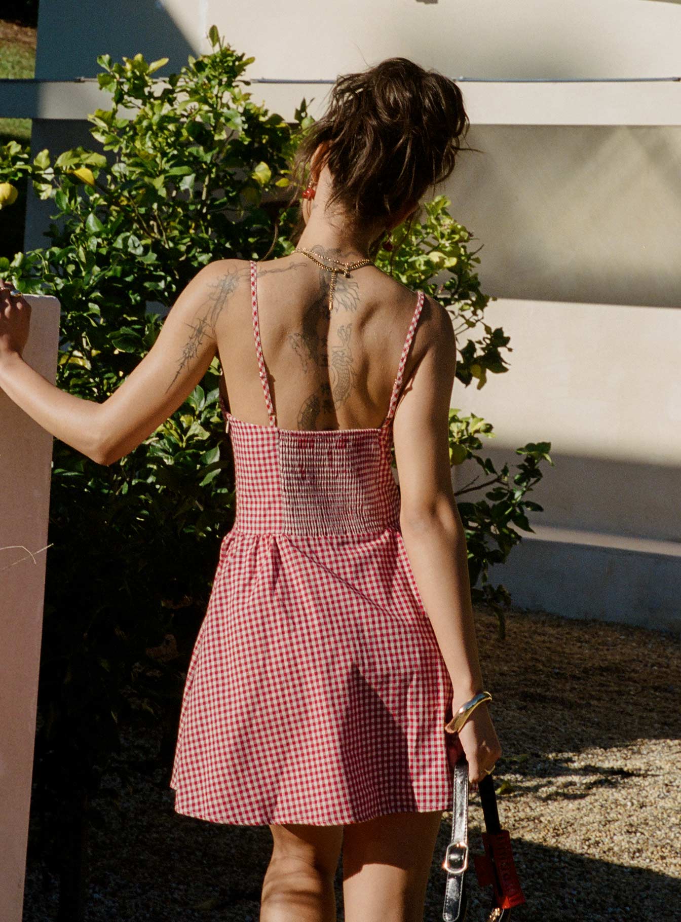 back view of model wearing Princess Polly Toulouse Mini Dress Red Gingham Scoop Neck 