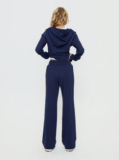 back view of model wearing Princess Polly Kari Distressed Patch Track Pant Navy Multi High Rise Pants 