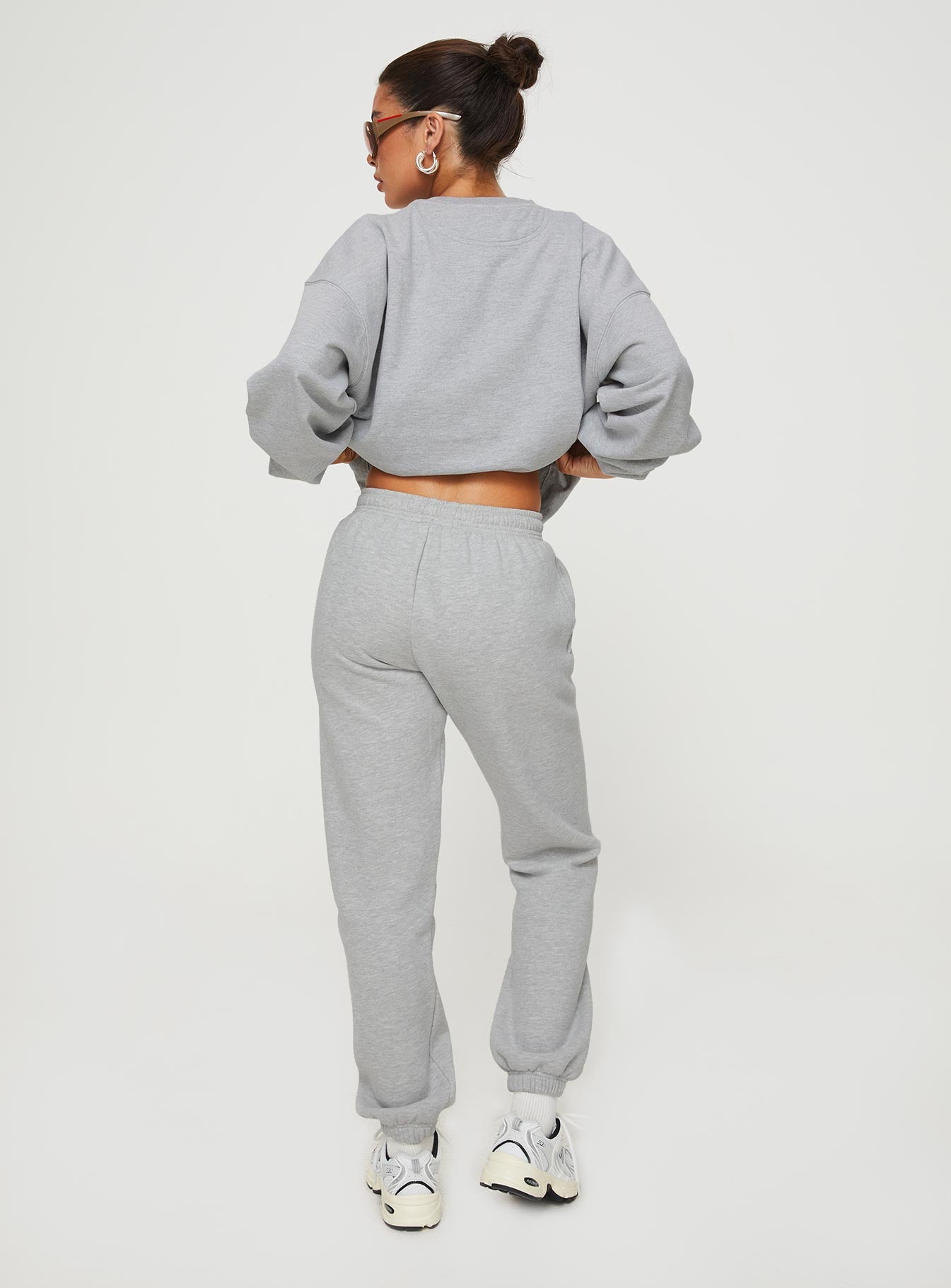 back view of model wearing Princess Polly Princess Polly Track Pants Cursive Text Grey Marle/ Red High Waisted Pants 